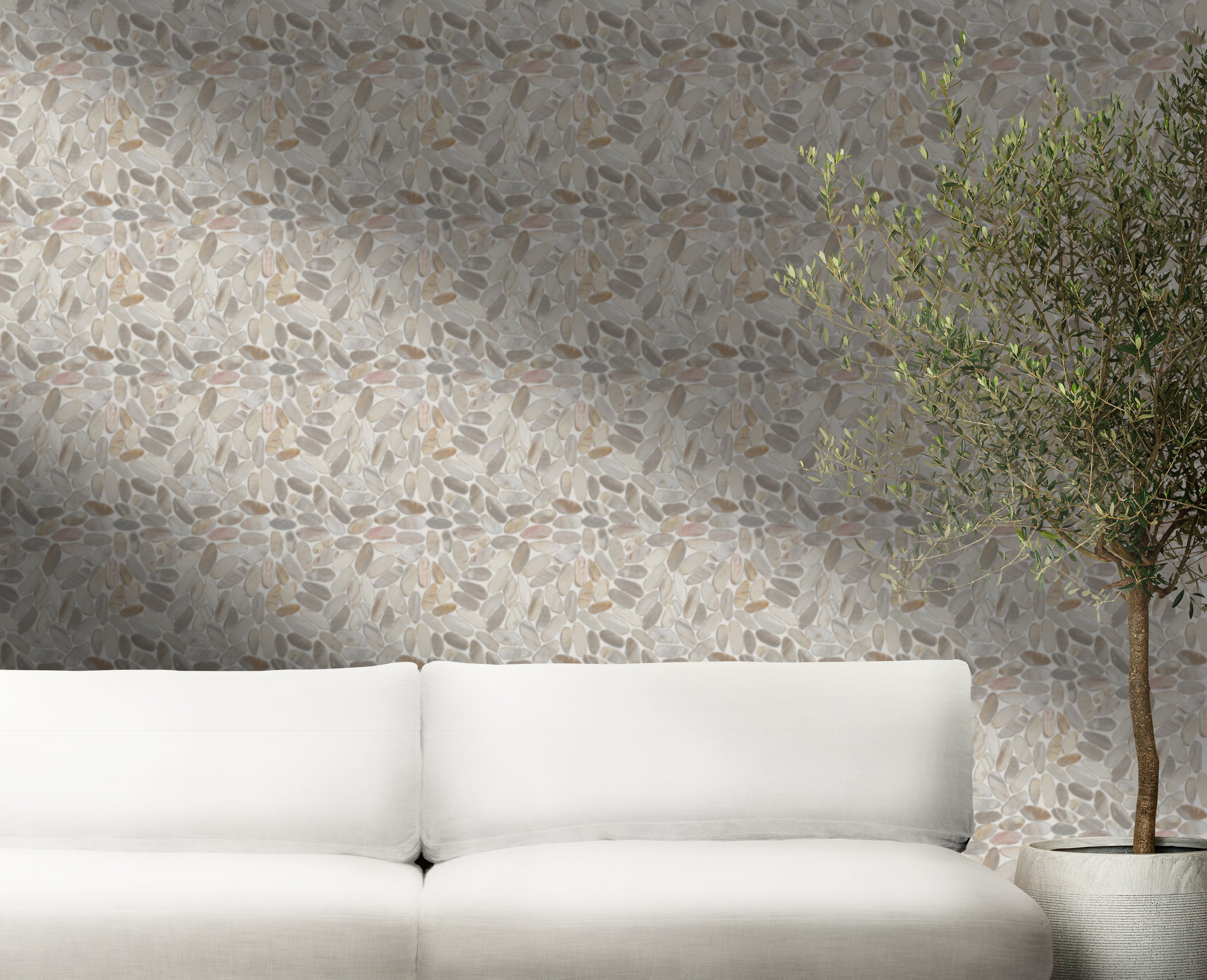 Petrifiedwood tile wall with white couch and small tree plant in front