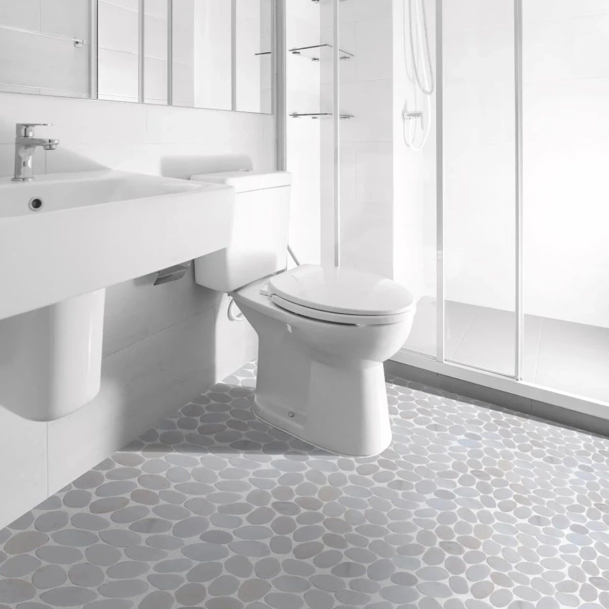 Snow white tile flooring in an all white bathroom