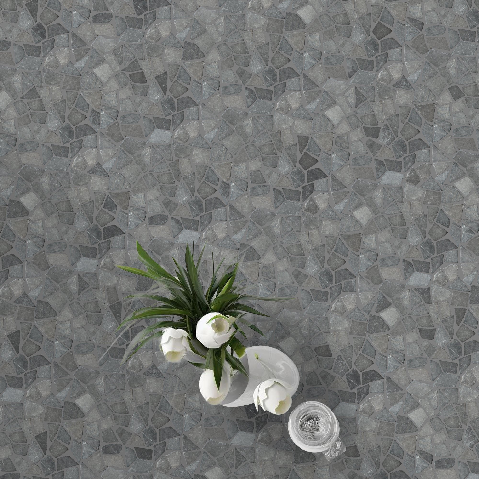 Grey random tile flooring with white tulips in a white vase on top