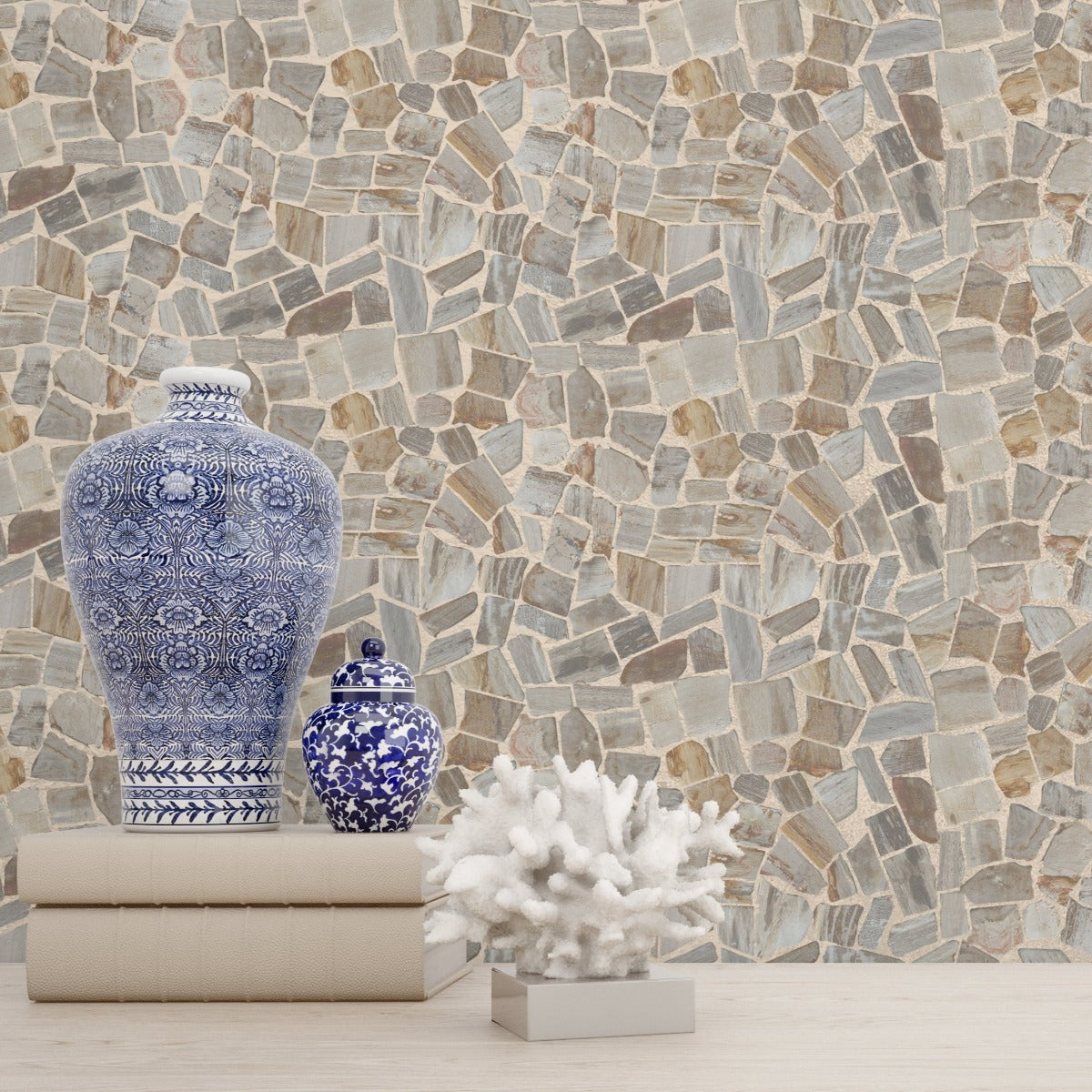 Mosaic Petrifiedwood tile wall with blue vase and books on counter in front of it
