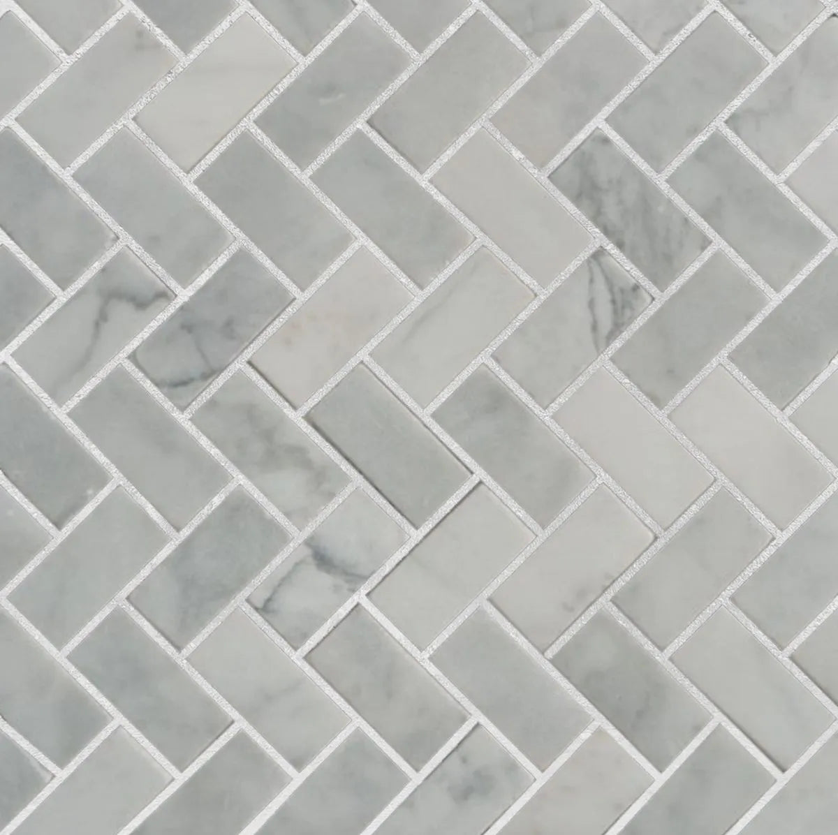 Heringbone carrara tile sample with grout