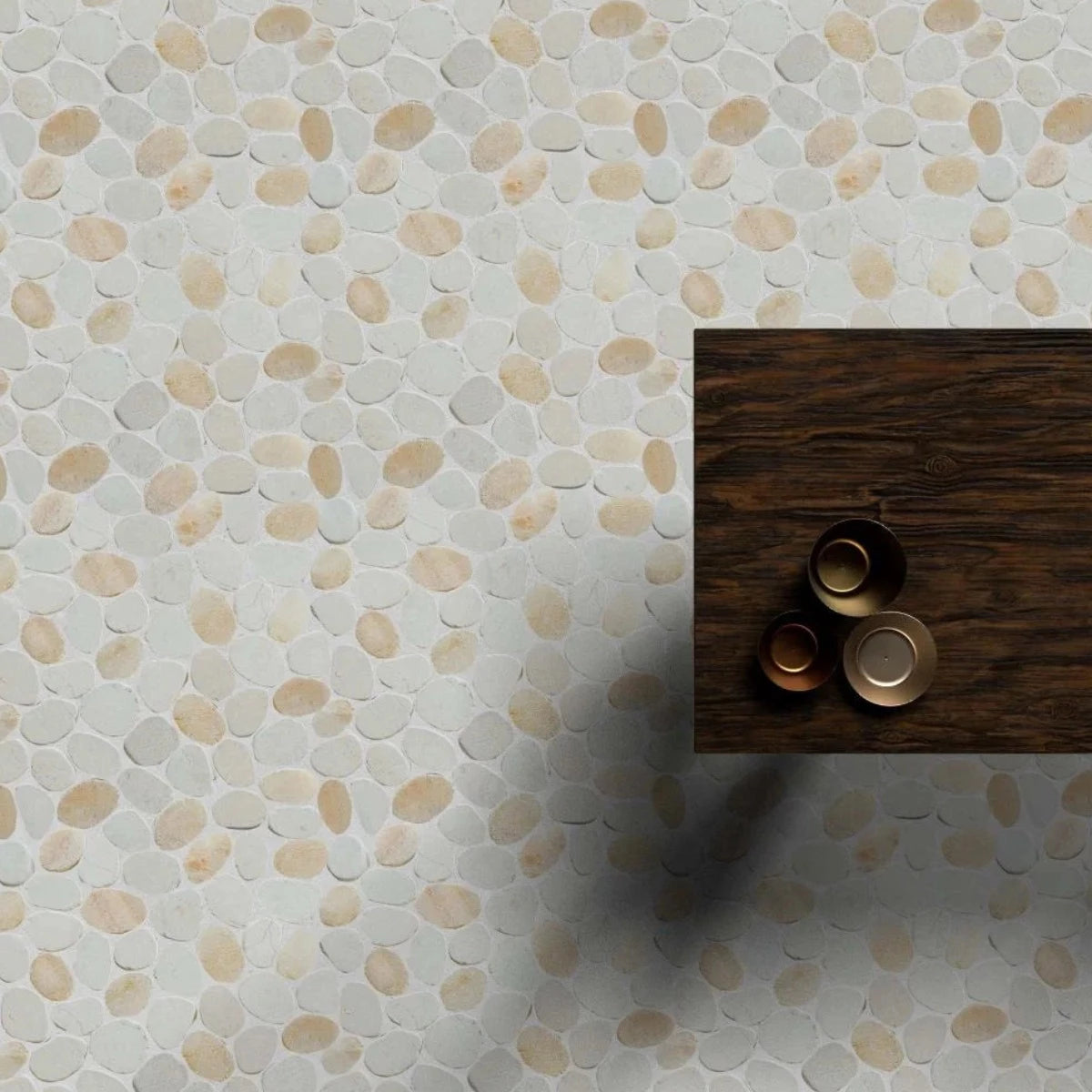 Oyster pebble tile flooring with wood table on top of it