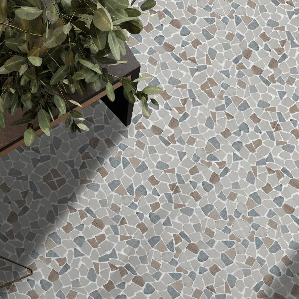 Sea Sand tile flooring with coffee table and small plant on top of the floor