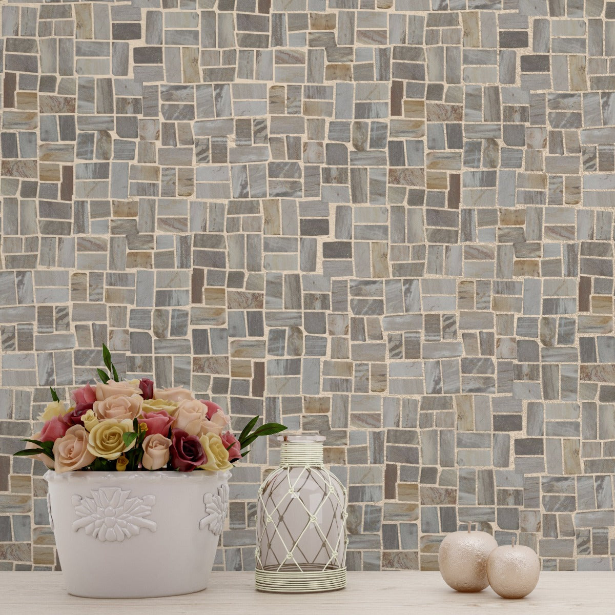 Random Petrified tile wall with small vase of pink and yellow roses in front of it